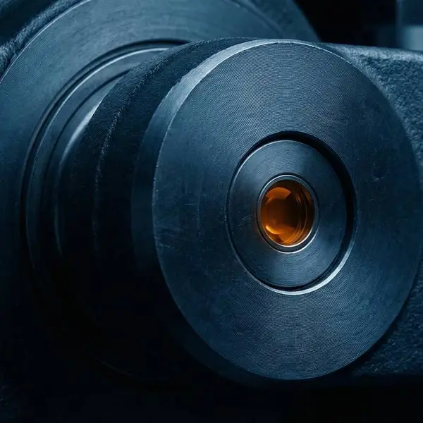 Close-up of a machined steel bearing housing with a bronze bush